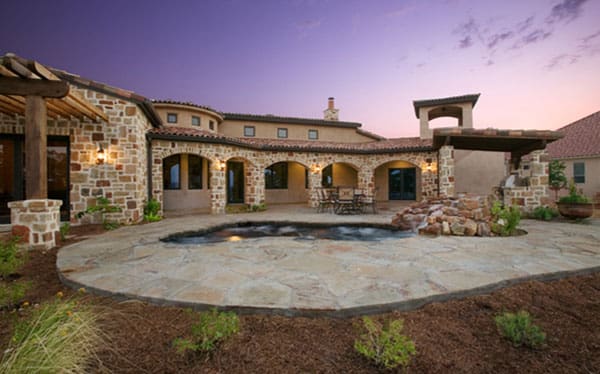 Stone villa backyard with small pool